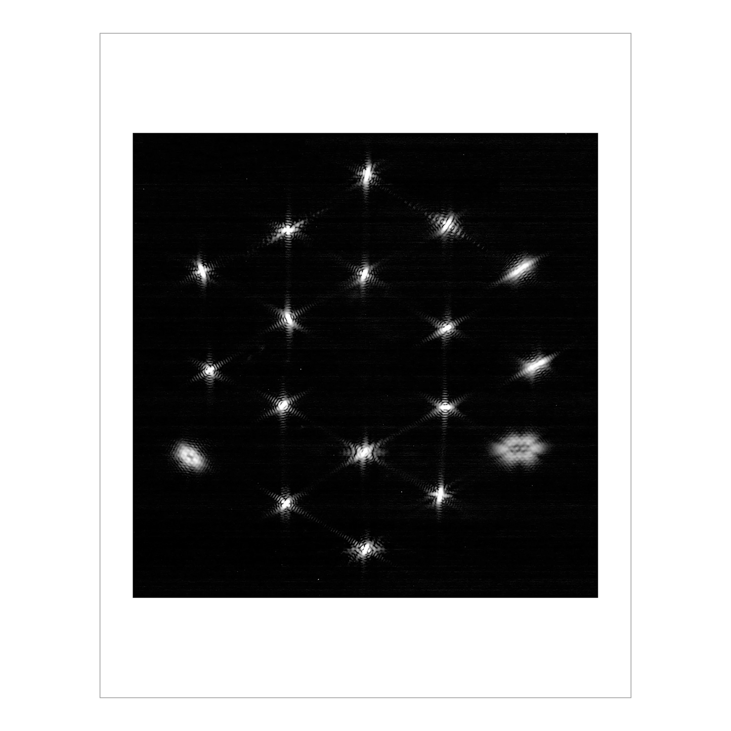 A star partially out of focus, repeated 18 times, once for each of the Webb’s mirrors, into a hexagonal formation.