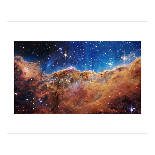 Jame Webb's cosmic cliffs, a red orange nebula fills the bottom half, above is blue space full bright stars.