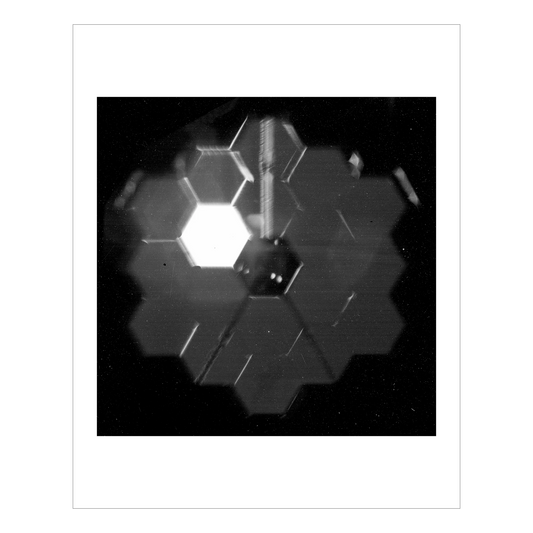Webb’s NIRCam photographs its own primary mirror pre alignment, one of the 18 hexagonal segments is illuminated.